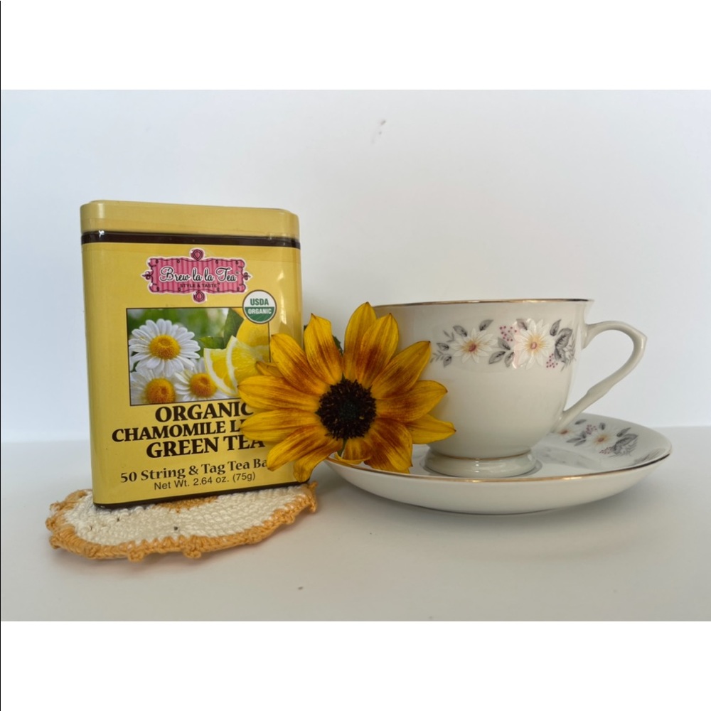 lovely vintage China tea cup w delicate yellow flowers and tea filled tin.